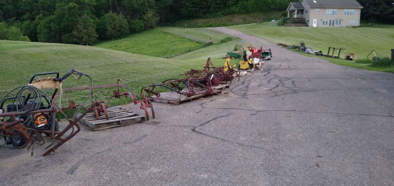 Farm equipment including cultivators and lawn garden tractor cab.