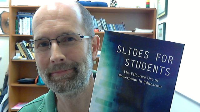 Picture of Gary Fisk holding the Slides for Students book.